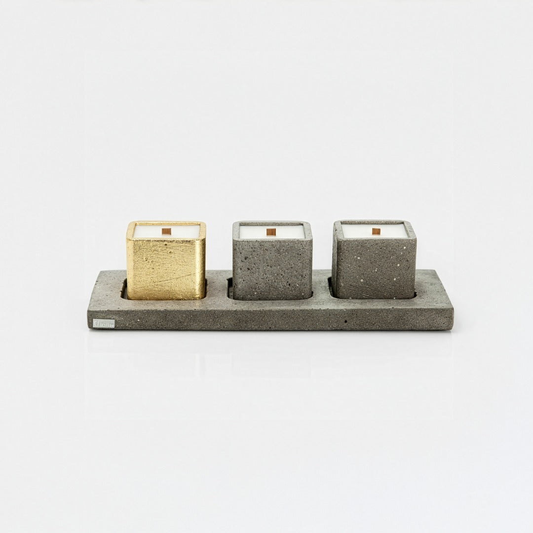 Concrete holder with three candle cubes on a white background