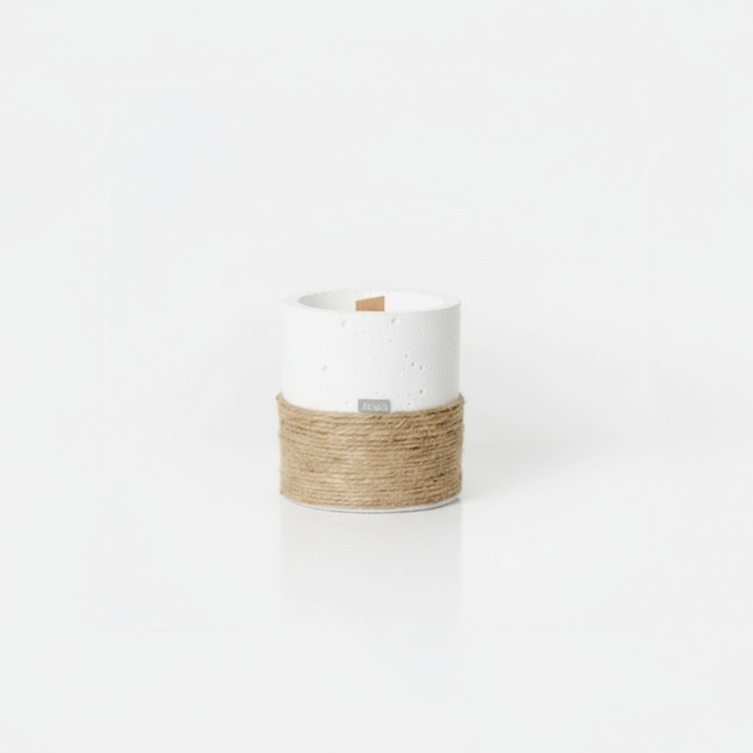White candle holder with a natural rope wrap on a white background